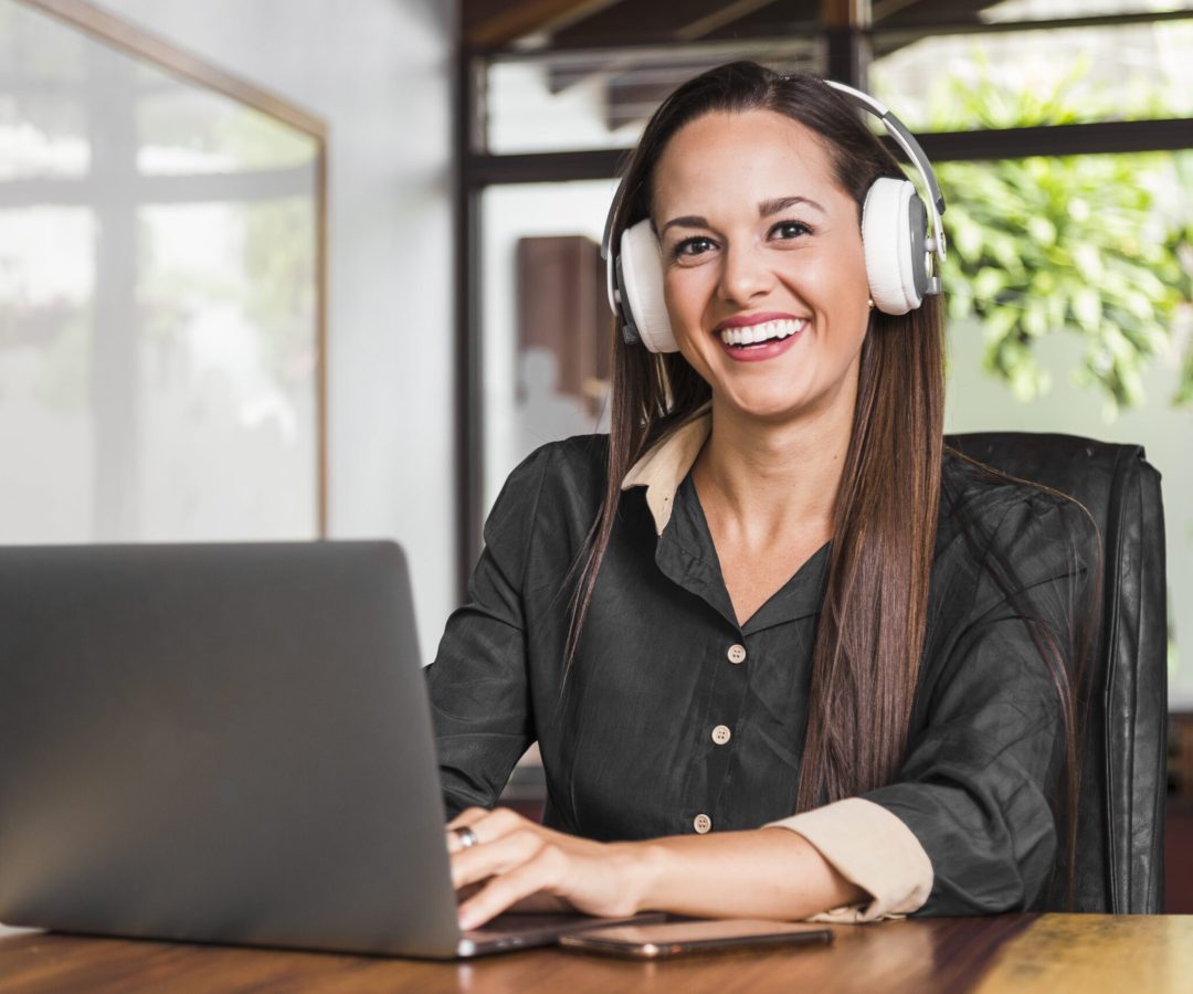 woman-wearing-headphones-looking-camera